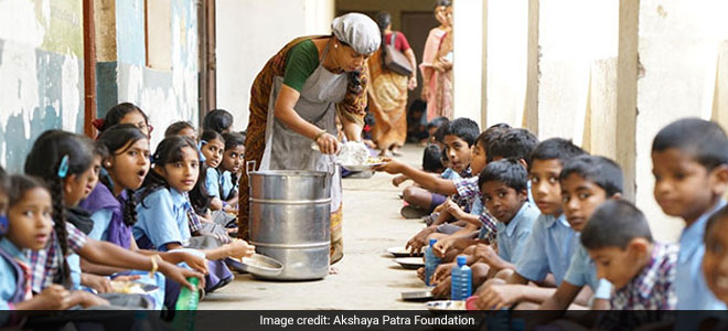 Lady serving kids